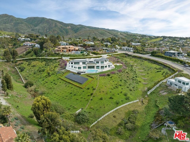 drone / aerial view featuring a mountain view