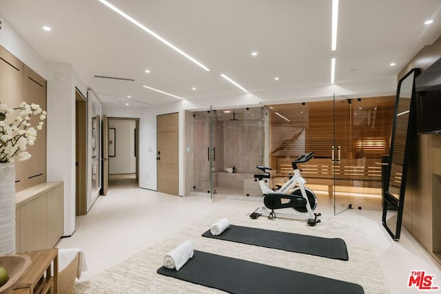 exercise area featuring a barn door