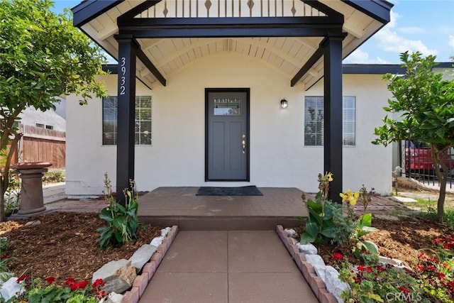 doorway to property featuring a porch