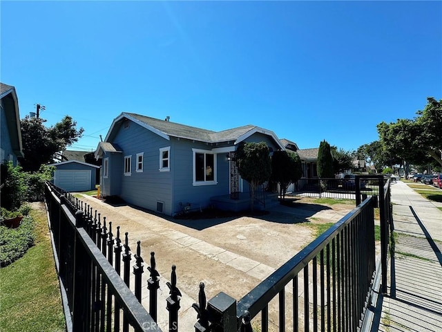 view of front of house with an outbuilding and a garage