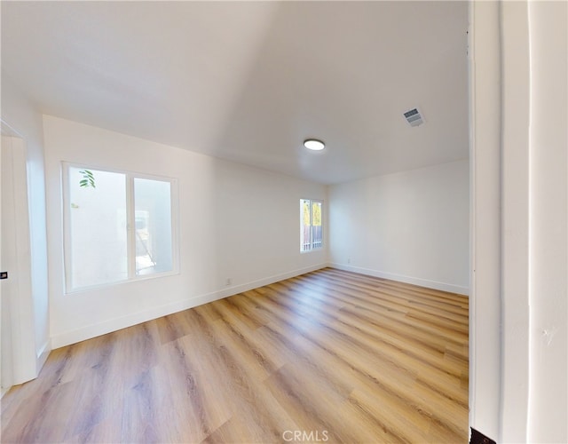 spare room featuring light hardwood / wood-style floors