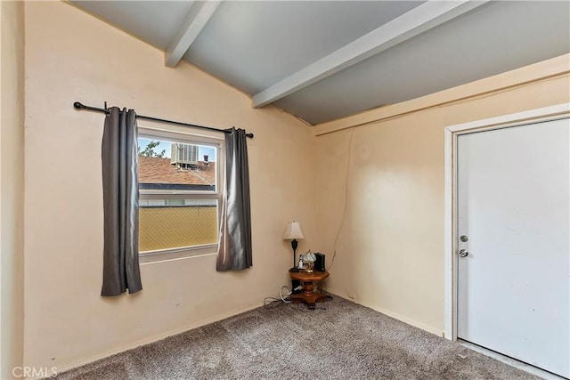 unfurnished room featuring carpet flooring, baseboards, and lofted ceiling with beams