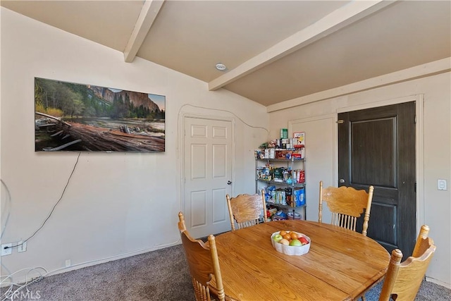 dining space with lofted ceiling with beams and carpet