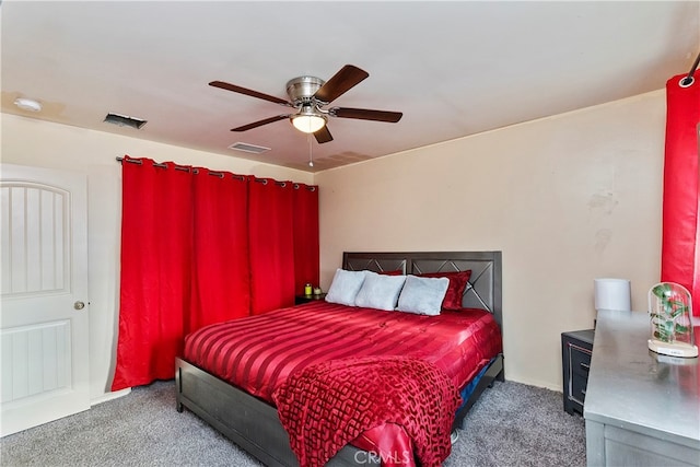 bedroom featuring dark carpet and ceiling fan