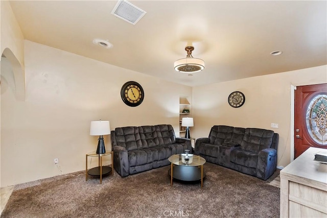 carpeted living area with visible vents