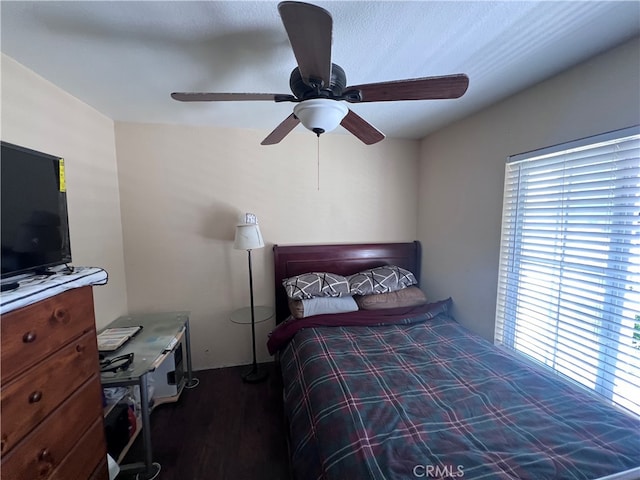 bedroom featuring ceiling fan and hardwood / wood-style floors