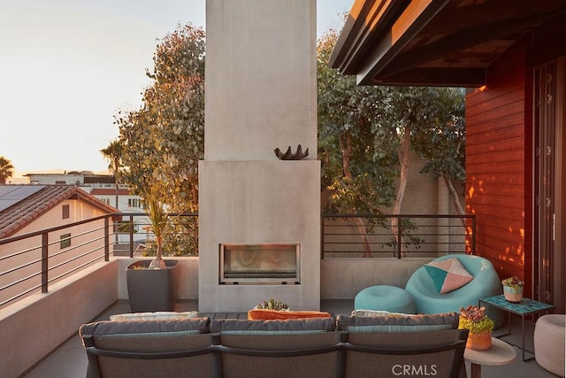 patio terrace at dusk with a balcony