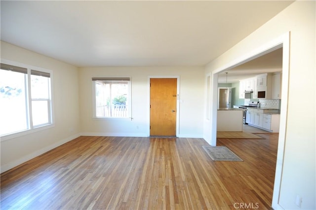 spare room with light wood-type flooring