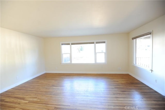 spare room featuring dark hardwood / wood-style floors