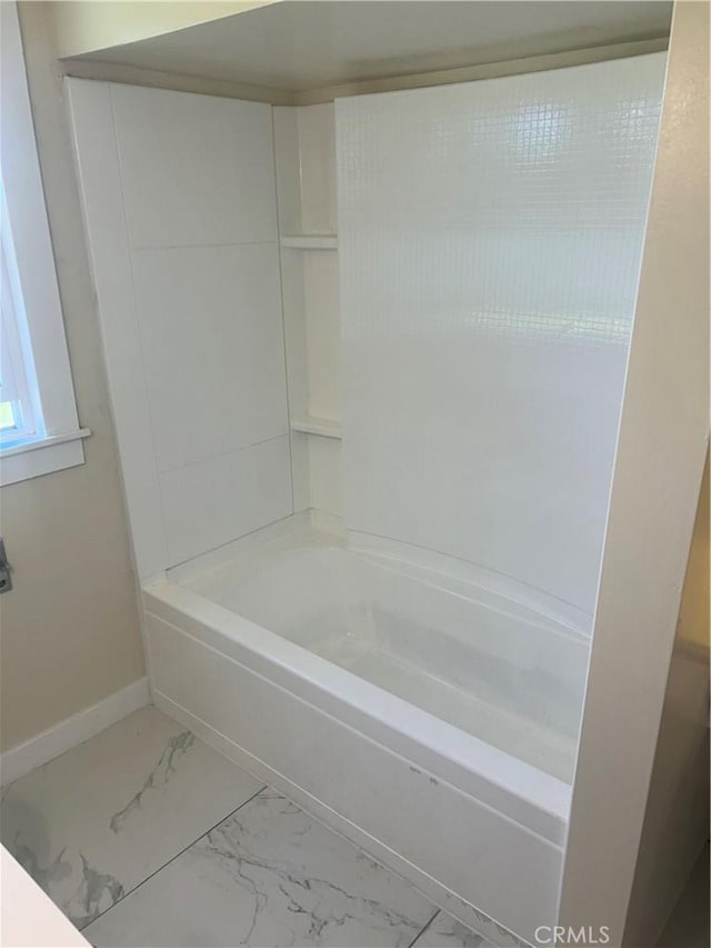 bathroom with bathing tub / shower combination