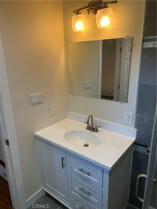 bathroom featuring vanity and tile patterned flooring