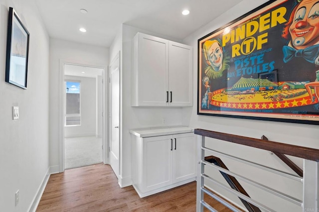 hall with light hardwood / wood-style flooring