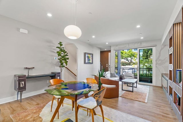 dining area with light hardwood / wood-style flooring