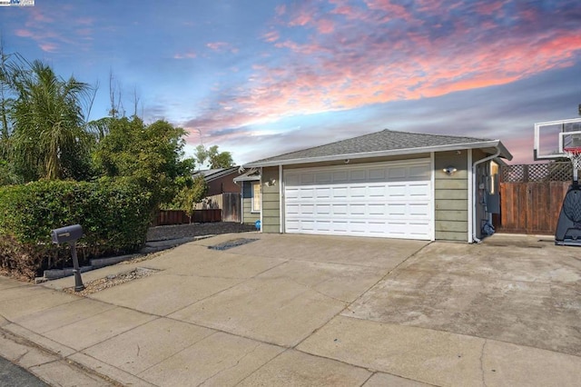 property exterior at dusk with a garage