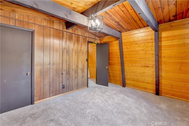 basement featuring light colored carpet and wooden walls