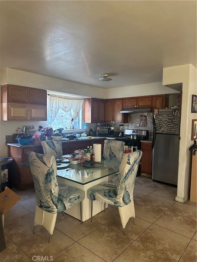 dining room featuring dark tile patterned flooring