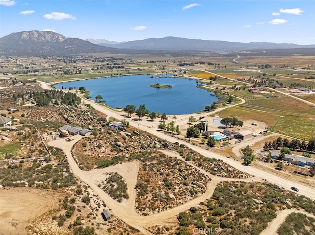 bird's eye view with a water and mountain view