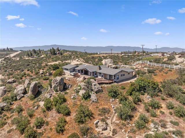 birds eye view of property featuring a mountain view