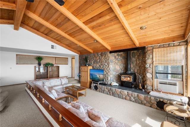 carpeted living room featuring cooling unit, wood ceiling, a wood stove, and vaulted ceiling with beams