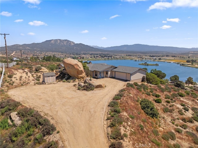 bird's eye view featuring a water and mountain view