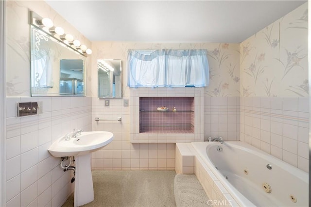 bathroom featuring tile walls and a relaxing tiled tub