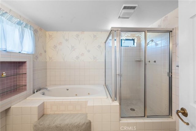 bathroom with separate shower and tub