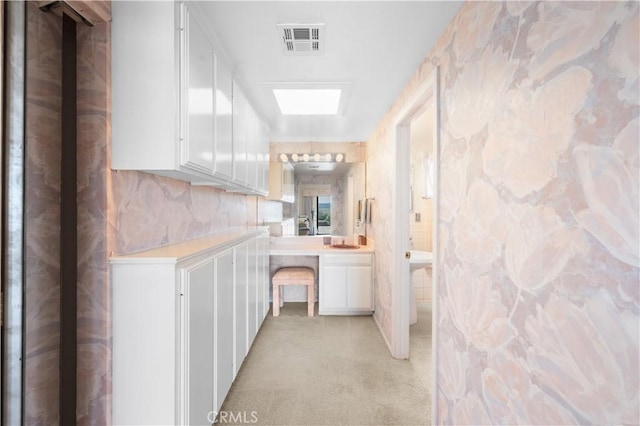 hallway with a skylight