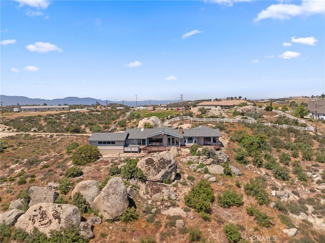 birds eye view of property with a mountain view