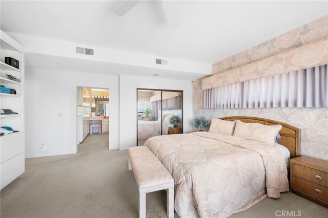 bedroom featuring ceiling fan, light colored carpet, and a closet