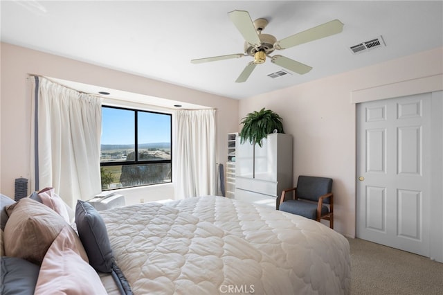 carpeted bedroom featuring ceiling fan