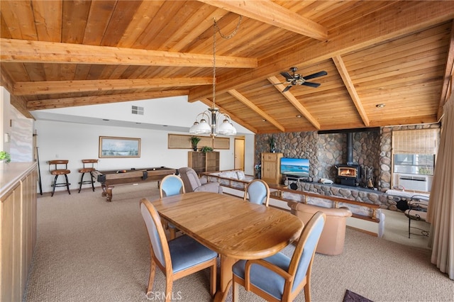 carpeted dining room featuring pool table, vaulted ceiling with beams, a wood stove, ceiling fan, and wooden ceiling