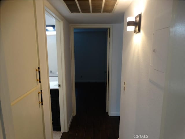 corridor with dark hardwood / wood-style floors