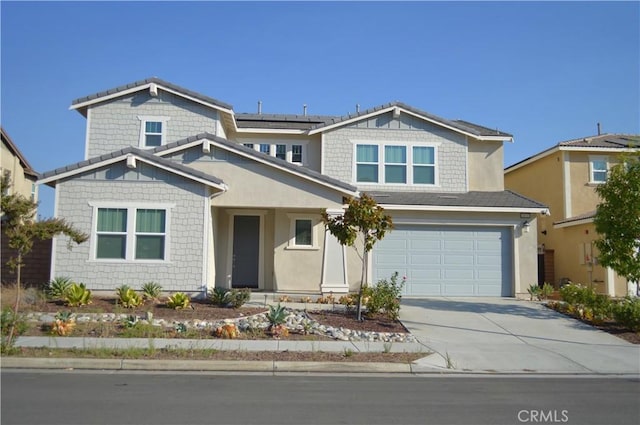 view of front of home featuring a garage and solar panels