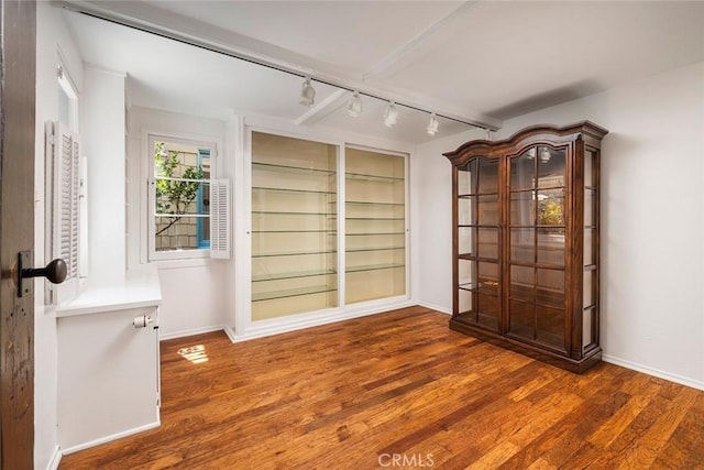 115 Apolena Ave, Newport Beach, CA 92662 - spare room featuring track lighting, wood finished floors, and baseboards