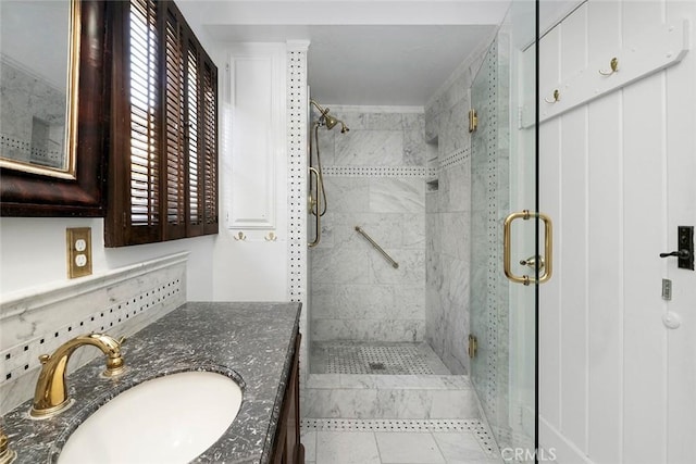 bathroom with backsplash, tile patterned flooring, vanity, and walk in shower