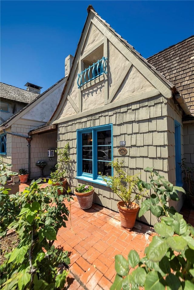 115 Apolena Ave, Newport Beach, CA 92662 - view of home's exterior with a chimney and a patio
