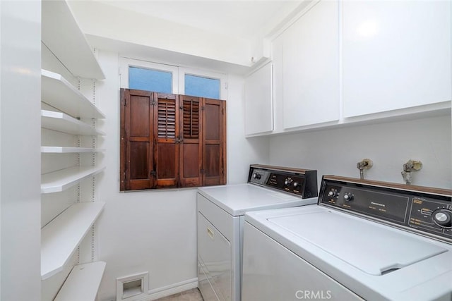 laundry area with washing machine and dryer