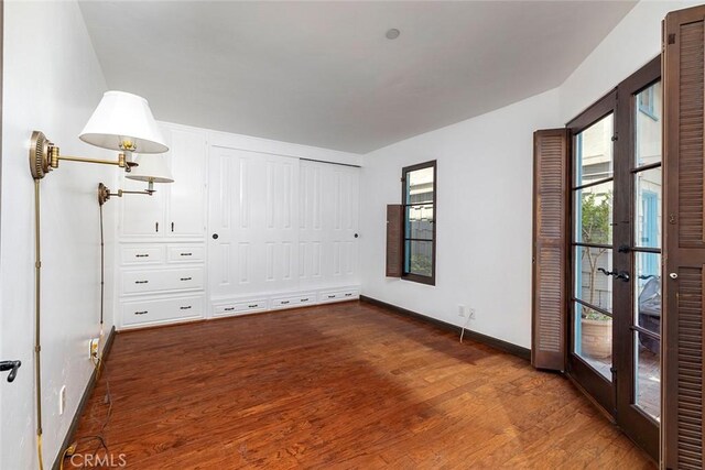 115 Apolena Ave, Newport Beach, CA 92662 - unfurnished bedroom featuring baseboards, dark wood-style floors, and french doors
