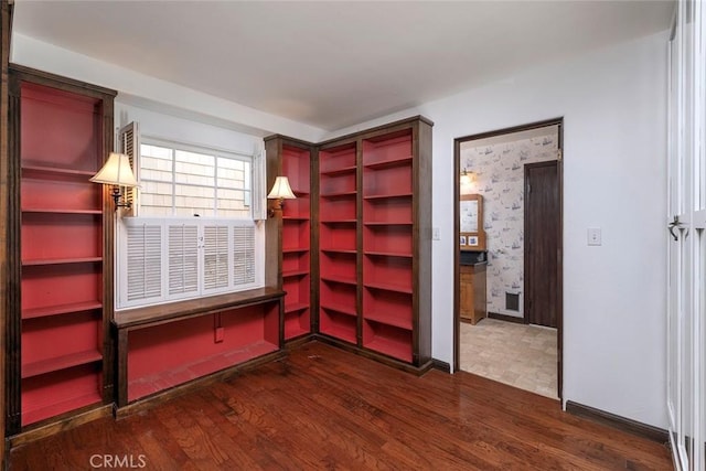 unfurnished bedroom with dark hardwood / wood-style floors