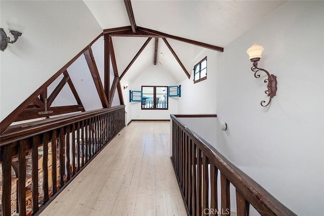 hallway featuring vaulted ceiling with beams and light wood-type flooring