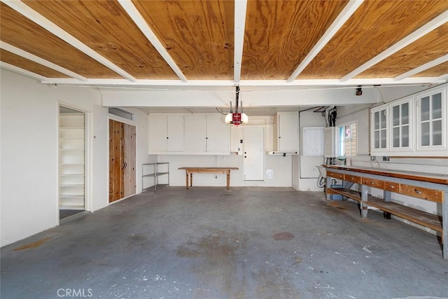 garage featuring a workshop area and a garage door opener