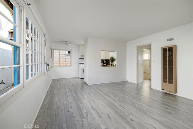 115 Apolena Ave, Newport Beach, CA 92662 - unfurnished living room with wood finished floors, ceiling fan, and baseboards