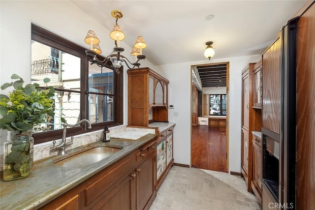 bathroom featuring a chandelier, hardwood / wood-style floors, and vanity