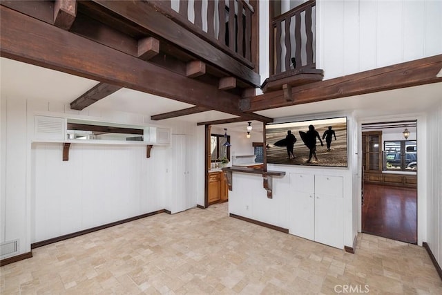 kitchen featuring wood walls