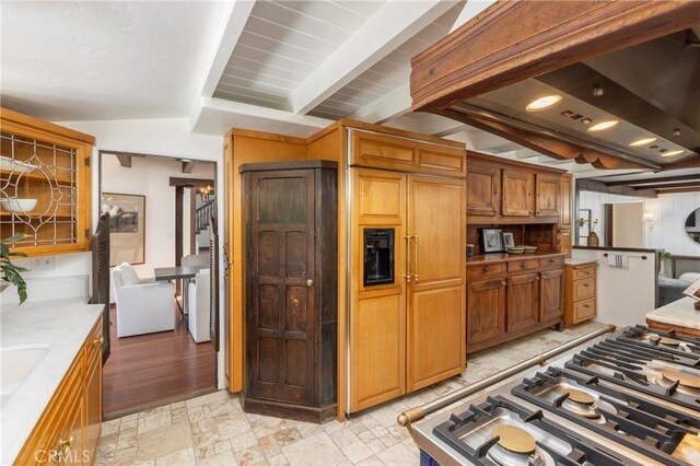 115 Apolena Ave, Newport Beach, CA 92662 - kitchen featuring stove, beamed ceiling, and brown cabinets