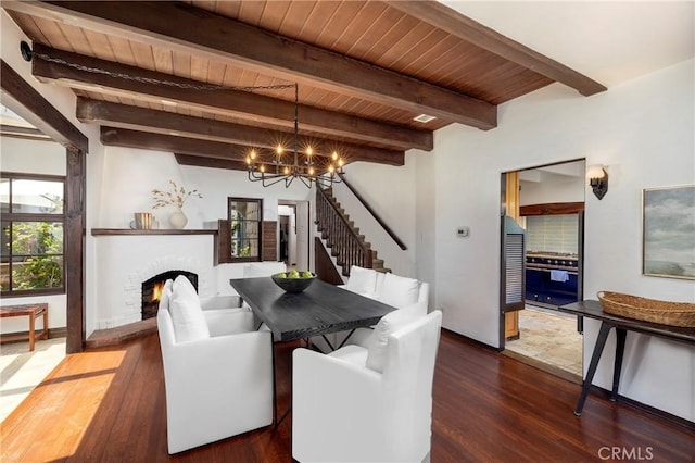 115 Apolena Ave, Newport Beach, CA 92662 - dining space featuring stairs, wood finished floors, a chandelier, a brick fireplace, and wooden ceiling with exposed beams