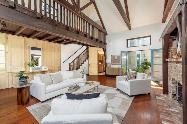 115 Apolena Ave, Newport Beach, CA 92662 - living room with beam ceiling, high vaulted ceiling, stairs, wood finished floors, and healthy amount of natural light