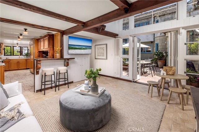 115 Apolena Ave, Newport Beach, CA 92662 - living area featuring stone tile flooring and beam ceiling