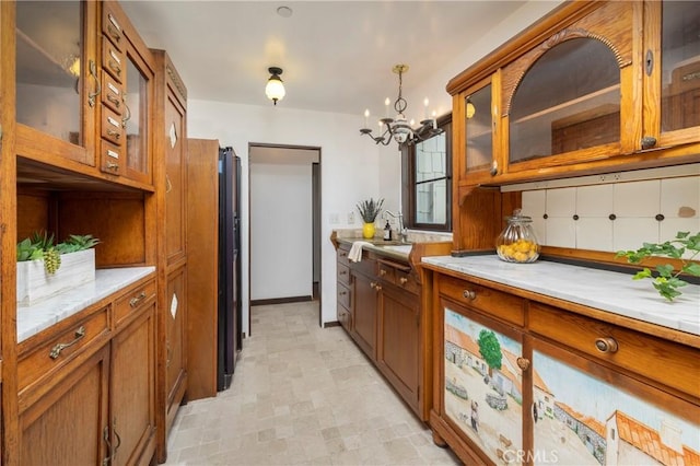 115 Apolena Ave, Newport Beach, CA 92662 - kitchen with brown cabinets, light countertops, and a chandelier
