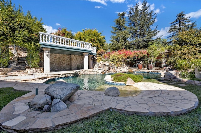 view of swimming pool with a patio